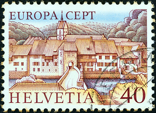 Swiss stamp shows St. Ursanne (1977) SWITZERLAND - CIRCA 1977: A stamp printed in Switzerland from the "Europa" issue shows St. Ursanne. doubs photos stock pictures, royalty-free photos & images