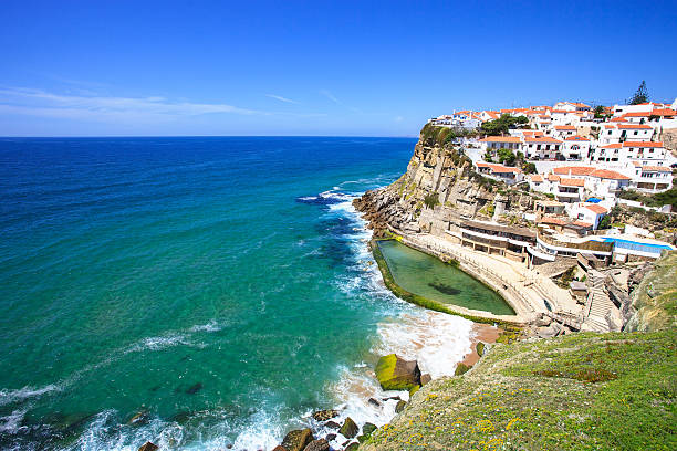 Azenhas do Mar white village, cliff and ocean, Sintra, Portugal. Azenhas do Mar white village landmark on the cliff and Atlantic ocean, Sintra, Lisbon,  Portugal, Europe. azenhas do mar stock pictures, royalty-free photos & images