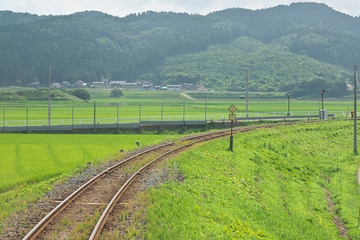 Akita, Japan - July 28, 2023: Single-track railway in rural zone in Akita, Japan