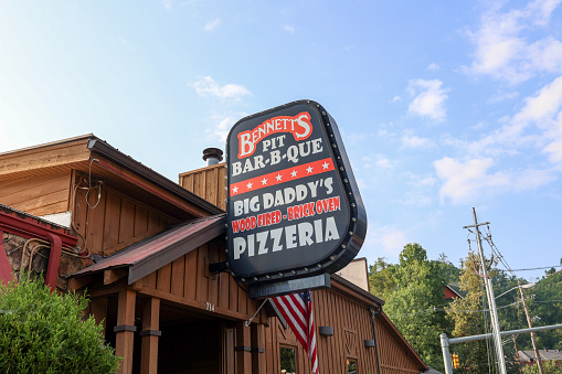 Gatlinburg, Tennessee, USA - August 1, 2023: The exterior of Bennetts Pit barbecue Restaurant on the Parkway in downtown Gatlinburg, Tennessee