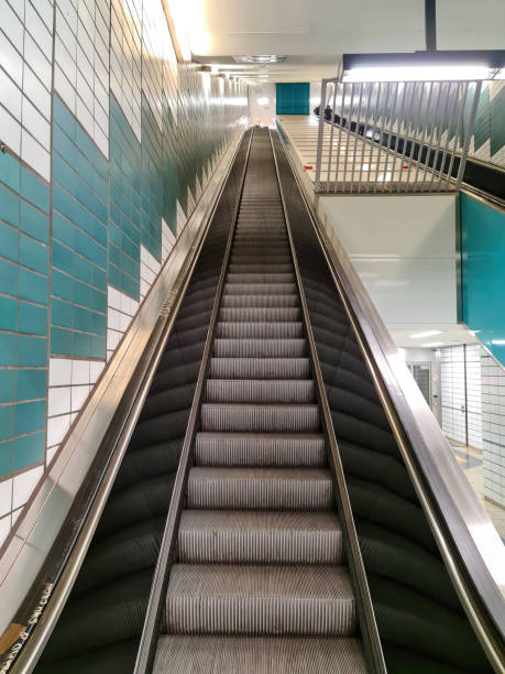 istock Close up of empty steps of an escalator in a perspective view. 1590664548