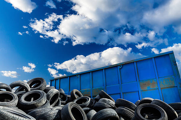 Recycling business, container and tires stock photo