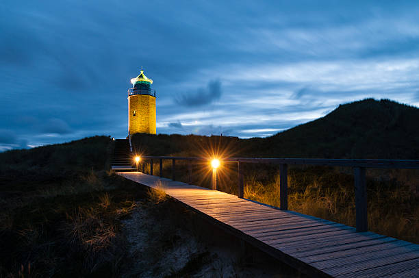 leuchtturm kampen - beach boardwalk grass marram grass stock-fotos und bilder