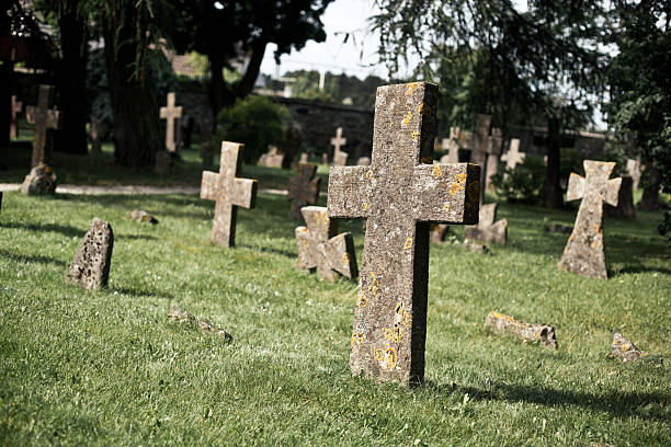 istock Moldy stone crosses in cemetery 159070723