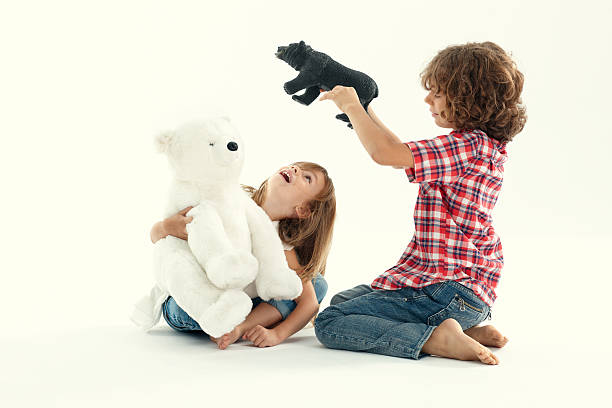 istock Brother and sister playing with teddy bears 159074403