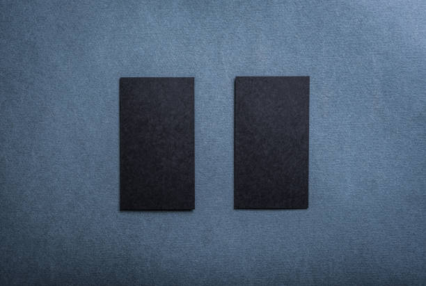 istock Black blank business card template on dark background. 1590757506