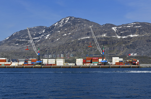 Nuuk / Godthåb, Sermersooq municipality, Greenland: Nuuk harbor container terminal, on Fyrø island, now a peninsula - Nuuk Harbor is the largest port in Greenland. The terminal is served mainly by container ships from the Royal Arctic Line (Government of Greenland) and Eimskip lines - Nuuk bay.