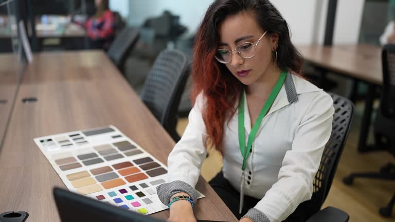 Young woman architect working in the office