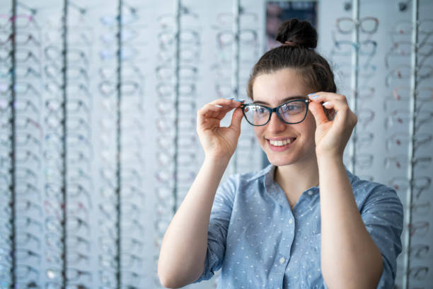 istock Looking for new pair of glasses. 1590818733
