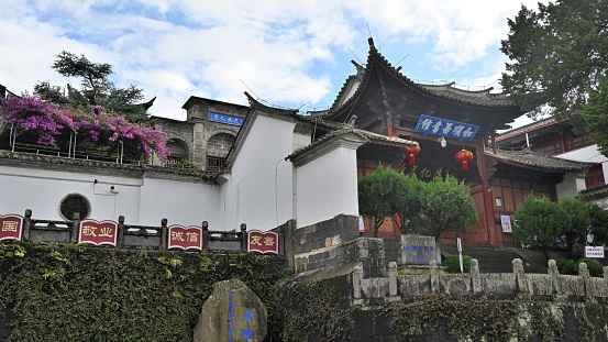 Heshun Ancient town, Tengchong City, Baoshan City, Yunnan Province, China.\nHeshun Ancient Town is a famous business town, cultural town and tourist town on the ancient Silk Road in the south, with a history of more than 600 years. Heshun has profound cultural heritage and beautiful natural scenery. Heshun has unique tourism resources, unique natural landscape and cultural landscape, and relatively complete ancient buildings of Ming and Qing dynasties. It is the first charming town in China, the national beautiful environment town, the national historical and cultural town, the top ten ancient towns in China, the first batch of beautiful livable demonstration towns in China, the third batch of Chinese traditional architecture culture tourism destination, the most beautiful ten villages in China, the famous tourist town in Yunnan, and the top ten towns in Yunnan.\nHeshun Library is one of the largest rural libraries in China. Founded by overseas Chinese in 1924, it is a traditional Chinese building with a front garden. It has a collection of more than 10,000 books, among which many ancient books are the most precious. The library covers an area of 5,577.34 square meters, currently has a collection of more than 130,000 volumes, divided into ancient books, Republic of China, modern three libraries, the collection of relatively rich literature, in 1980 was incorporated into the national public library system; It is still in normal operation and is also a famous tourist attraction.