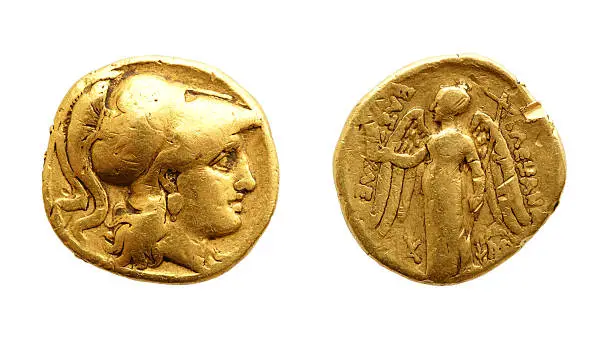 The two sides of an ancient gold coin isolated on white.
