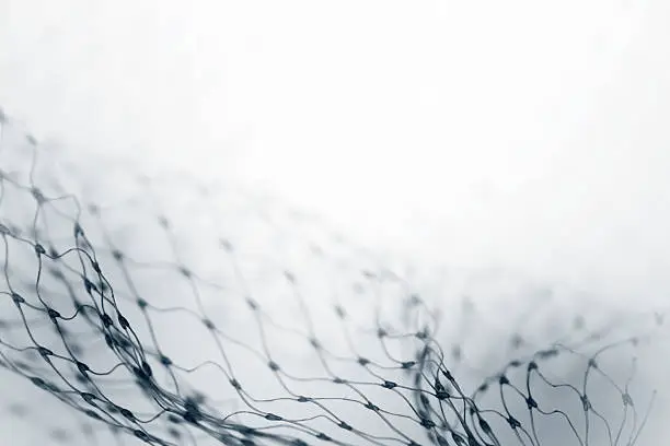 Closeup of abstract fishnet on white background