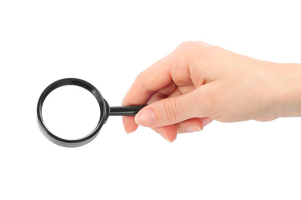 istock Woman hand holds magnifier 159087304