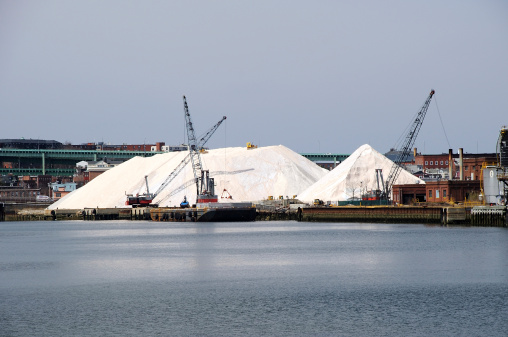 These mountains of salt are stockpiled in East Boston and stand ready to keep bridges and roads clear of ice and snow, East Boston, MA