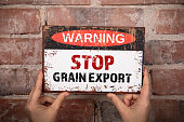 Stop Grain Export Concept. Warning sign on brick background