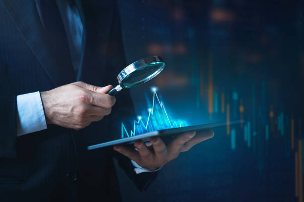 istock Businessman holding tablet with financial graphs. Planning, challenge and business strategy. 1590905919
