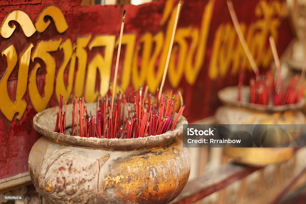 Red incense sticks Red incense sticks in ceramic pots, selective focus Ancient Stock Photo