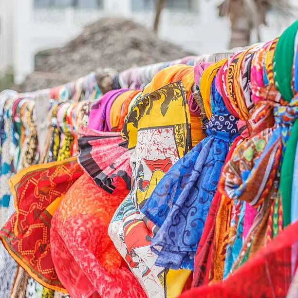 Colorful shop of sarongs and scarves on the beach.Selective focus.Mombasa,Kenya,Africa.