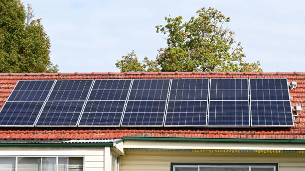 istock Solar electric panels on a house roof 1590983710