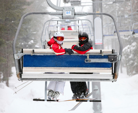 Couple of skiers on a ski-lift