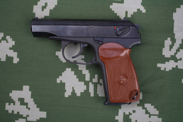 The Makarov-Walther pistol or PM (Pistolet Makarova, lit. Makarov's Pistol) is a Soviet semi-automatic pistol stolen from german Walther PP pistol on russian army camouflage uniform background.
