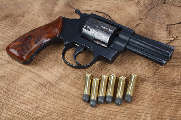 istock Revolver gun with ammunition 1591049431