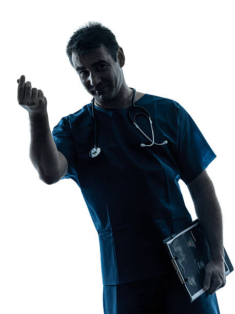 istock doctor man silhouette portrait gesturing money 159105410