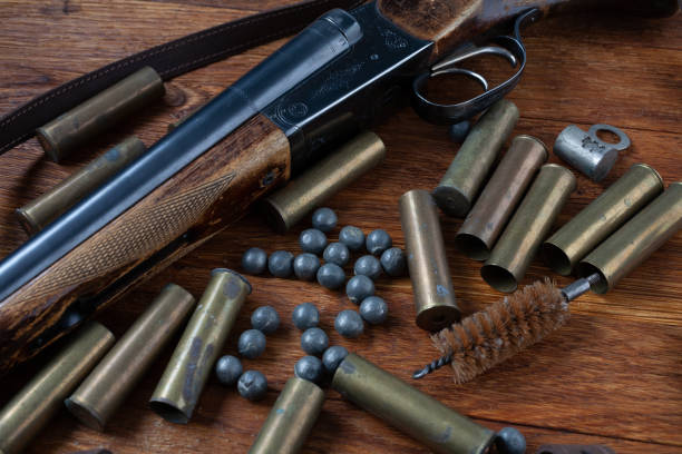 istock Hunting shotgun with brass cases and accessories for cartridge reloading. 1591054524