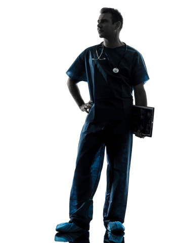 one caucasian man doctor surgeon medical worker  full length silhouette isolated on white background