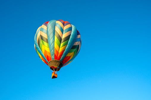 istock Flying colorful balloon in bright blue sky, Adirondack, Queensbury, New York 1591065937