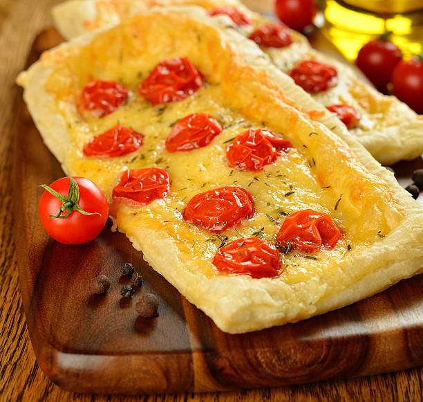 Tart with cheese and cherry tomatoes