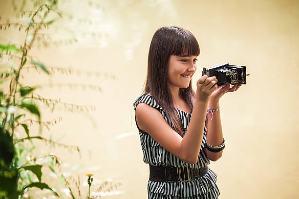 Girl with antique camera
