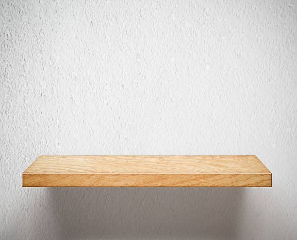 istock Wooden shelf on white wall 159114330