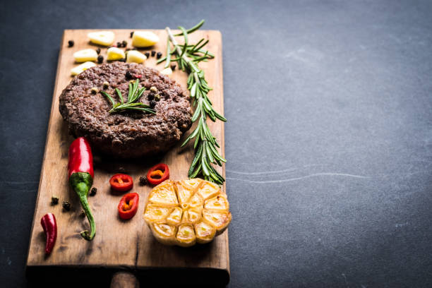 istock Beef burger cutlet with herbs and spices 1591193934