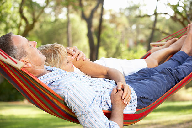 istock Senior Couple Relaxing In Hammock 159120007