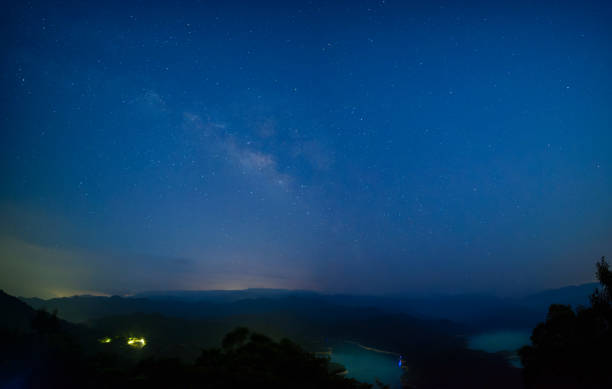 istock Galactic Serenity: Nighttime Skyline at the Mountain Summit. 1591206243