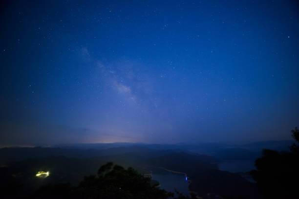 istock Galactic Serenity: Nighttime Skyline at the Mountain Summit. 1591206250