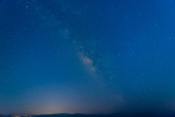 istock Galactic Serenity: Nighttime Skyline at the Mountain Summit. 1591206254