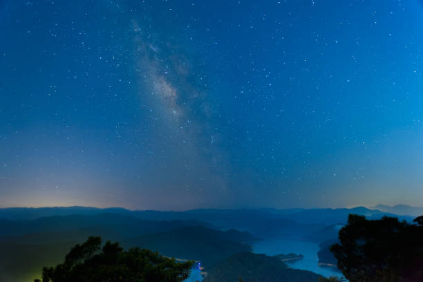 istock Galactic Serenity: Nighttime Skyline at the Mountain Summit. 1591206256