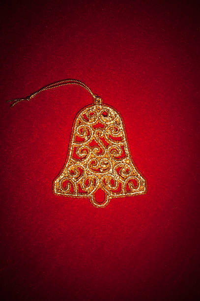 istock golden bell on red velvet 159120680