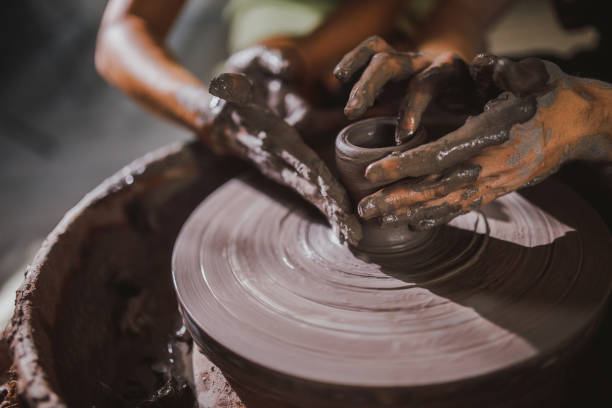 istock two pottery artist working on the pottery wheel in workshop 1591213725