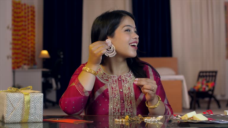 A pretty Indian girl getting ready for festival celebration - Indian Festival, Raksha Bandhan / Bhai Dooj / Diwali preparation