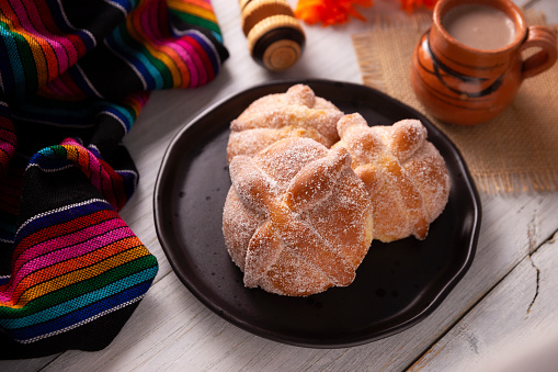 Pan de Muerto. Typical Mexican sweet bread that is consumed in the season of the day of the dead. It is a main element in the altars and offerings in the festivity of the day of the dead.