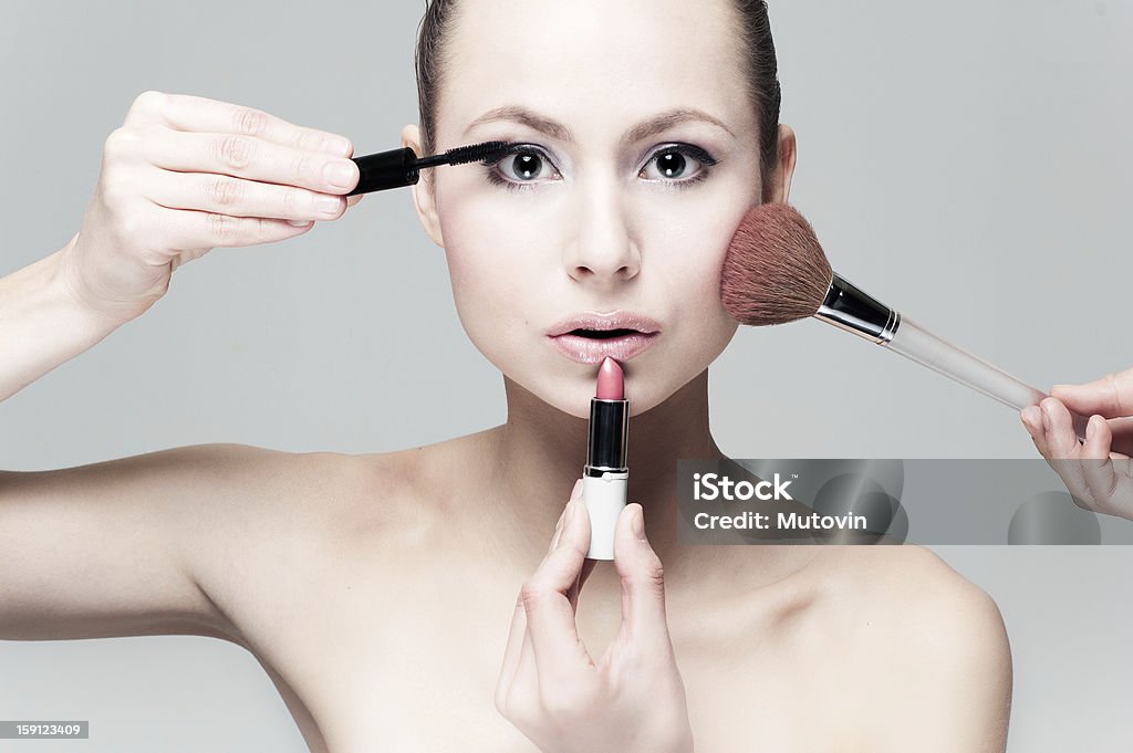 Applying professional make up make up portrait Adult Stock Photo