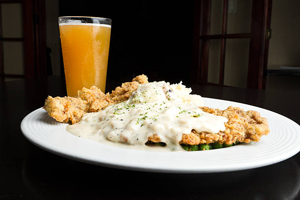 Chicken Fried Steak with Beer Chicken Fried Steak with Beer and Green Peas chicken fried steak stock pictures, royalty-free photos & images