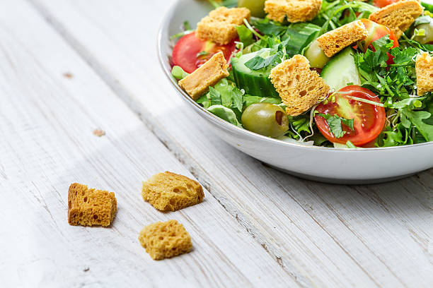 istock Close-up on a fresh Caesar salad made of vegetables 159124670