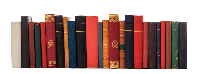 Books standing in a row isolated on white background.