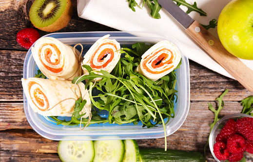 lunch box- sandwich wrap with smoked salmon and salad