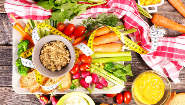 istock healthy eating- vegetable stick and dipping sauce 1591266775