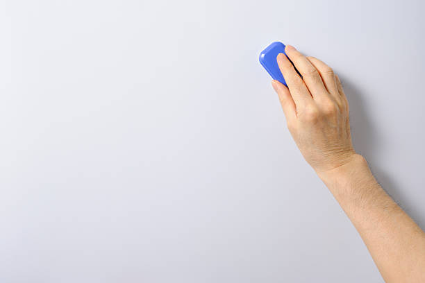 Hand Erasing The Letter Of The Whiteboard Stock Photo - Download Image Now  - Whiteboard - Visual Aid, Eraser, Board Eraser - iStock